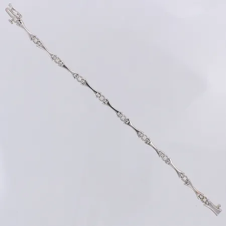 Armband vitguld diamanter 10 x ca 0,03ct längd 15,5cm bredd 4,2mm Guldfynd, original etui, 18K Vikt: 9,2 g