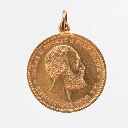 Mynt 20kr 1886, Ø23mm, 21K, ögla i 18K. Vikt: 9,2 g