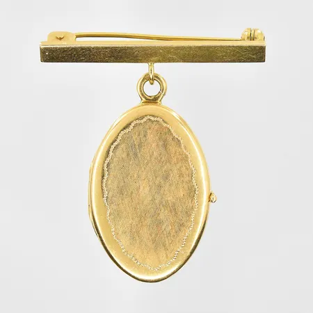 Brosch med integrerat hänge medaljong, längd 48mm, bredd 34mm, ostämplad, 18K. Vikt: 7,7 g