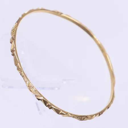Armring mönstrad dekor Ø57mm bredd 3mm, ostämplad, 18K Vikt: 11,9 g