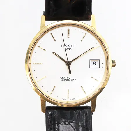 Herrur Tissot Goldrun 18K, Ø33mm, quartz, repigt plexiglas, svart läderband, bruksslitage på band, batteribyte krävs, inga tillbehör.