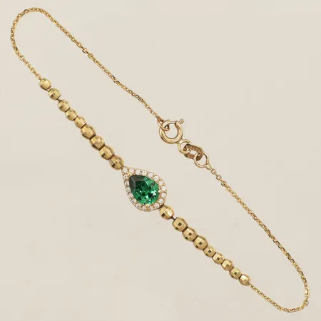Armband med integrerat hänge längd 18,5cm bredd 2,5mm 14K Vikt: 4,1 g