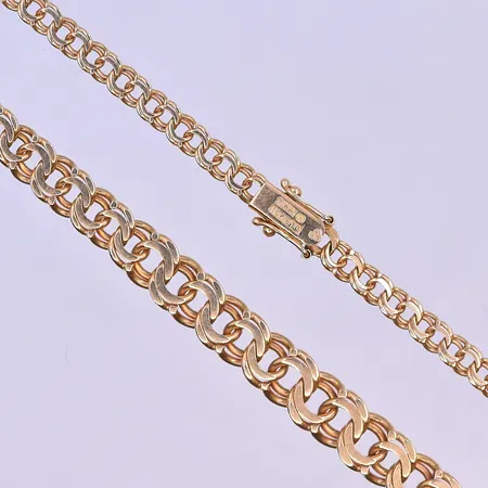 Armband Bismarck med 2 berlocker längd 19cm bredd 5mm 18K. Vikt: 11,9 g