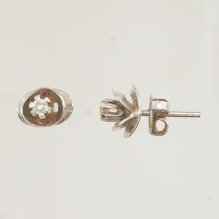 Örhängen diamanter 2x ca 0,04ct, 7x6mm 18K 1,8g.
