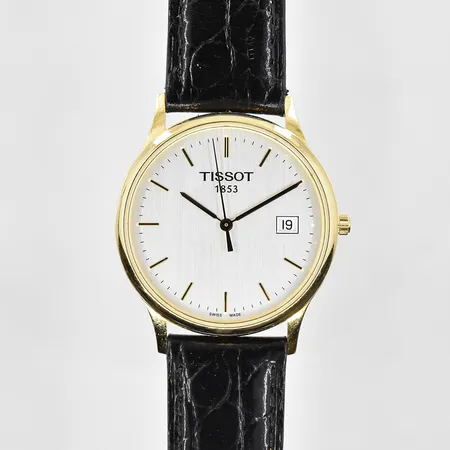Herrur Tissot 18K, quartz, Ø34mm, refnr T913410A, serienr 14AN0000211, datum, läderband, graverad bakboett, inga tillbehör. Bruttovikt 32,8g.