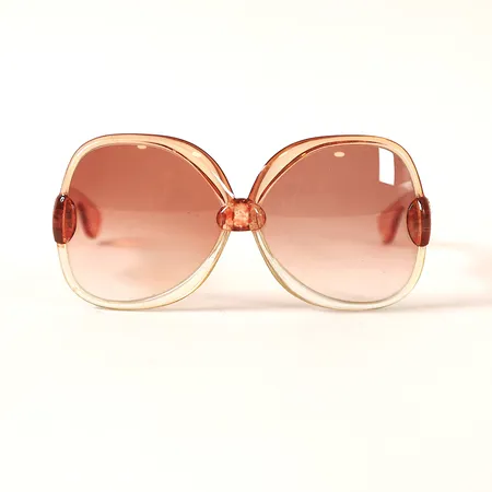 Solglasögon Yves Saint Laurent 1970-tal, orangemelerad plast, märkta France 653, repor