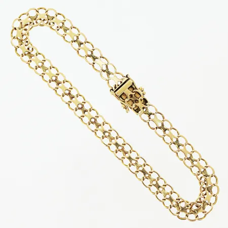 Armband X-länk längd 18,5cm bredd 10mm 18K.  Vikt: 14,3 g