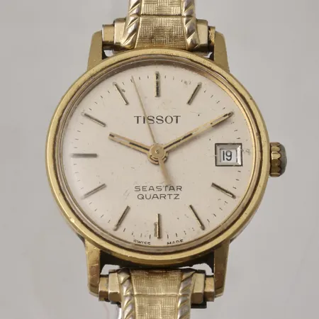 Damur Tissot Seastar quartz 18K guld, Ø21mm, datum, flexband i gulmetall, i behov av batteribyte personlig gravyr.