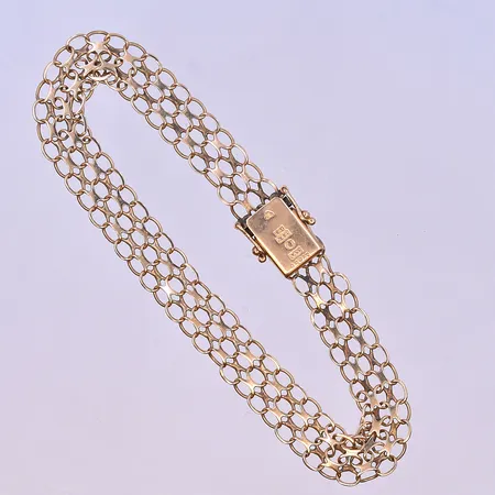 Armband X-länk längd 19,5 cm bredd 6 mm 18K. Vikt: 8,7 g