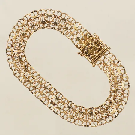 Armband X-länk med stav längd 16,0cm bredd 9,4mm år 1986 18K Vikt: 8,7 g