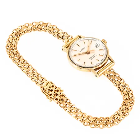 Damur Tissot Seastar Quartz guld 14K Ø22mm datum, plexiglas, urband X-länk guld 18K total längd 20cm bredd 6mm, repigt plexiglas. Går ej - Batteribyte krävs? Bruttovikt: 19,6g.