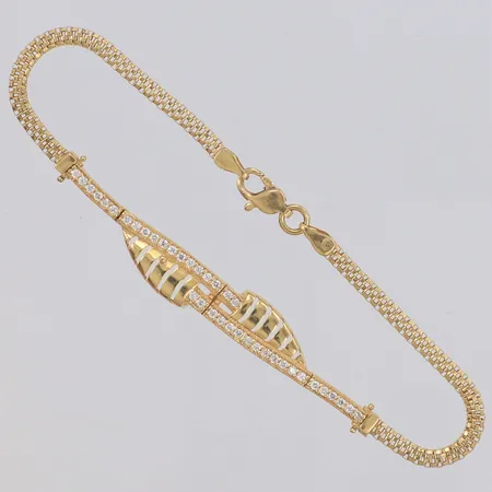 Armband med vita stenar, längd 18,5cm, bredd 7,6mm, 18K Vikt: 6,4 g