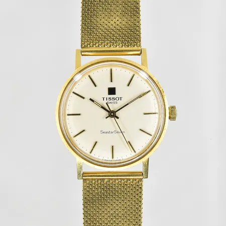Herrur Tissot Seastar Seven 18K med länk 18K, manuell, Ø34mm, graverad bakboett, inga tillbehör. Bruttovikt 70,8g