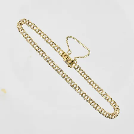 Armband Bismarck längd 19½cm, bredd 4mm, säkerhetskedja, 18K. Vikt: 5,2 g