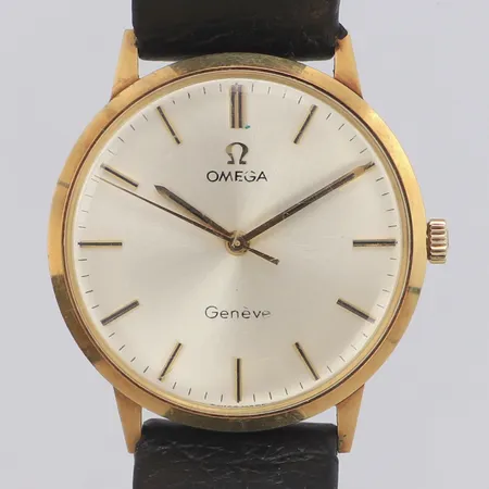 Armbandsur Omega Geneve 14K, manuell, 33mm, repigt plexiglas, gravyr, läderarmband ej original, etui. 