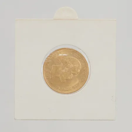 Mynt Oscar II 10kr år 1883, etui, 21,6K 4,5g.
