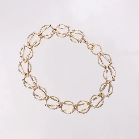 Armband längd 19cm bredd 10,2mm, lås i 18K, bucklig. 14K Vikt: 7,1 g på auktion i Skärholmen hos Pantbanken Sverige
