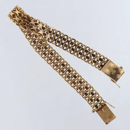 Armband X-länk längd 19,5cm bredd 10,5mm 18K. Vikt: 27,5 g på auktion i Kista hos Pantbanken Sverige