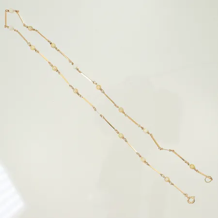 Halsband med 15 pärlor Ø3,5mm, längd 40cm, saknar 2 pärlor, 18K 5,3g totalt.
