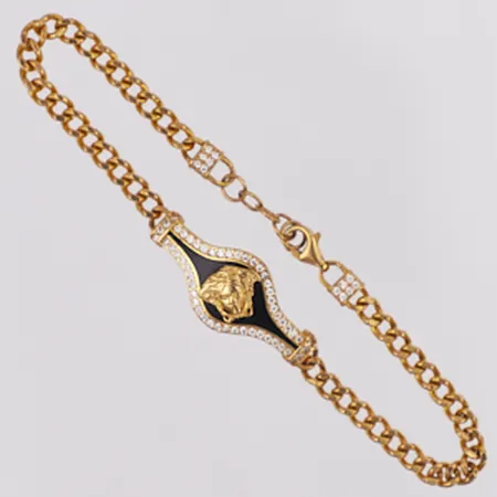 Armband Pansar Medusa samt svart och vita stenar längd 17,5-19,5cm, bredd 3,6-12,2mm, OBS! Ej märkesdesign, 21K Vikt: 8,1 g