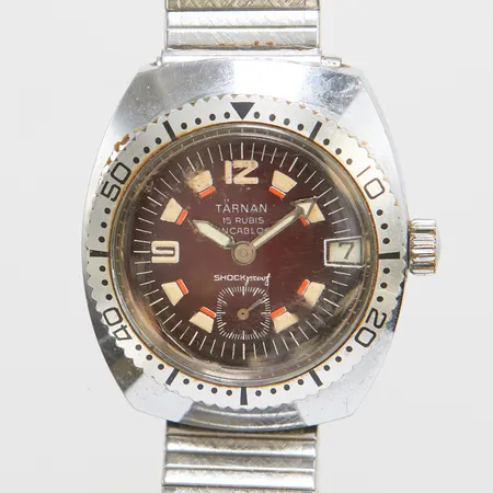 Herrur Tärnan, manuell, stål, 32mm, liten sekundvisare, datum, plexiglas repig, flex armband i stål, inga tillbehör.