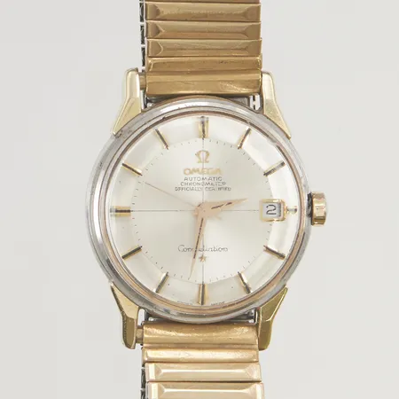 Herrur Omega Constellation guld på stål, "Pie Pan", 34mm, manuell, originalglas, saknar boettring, skadad krona, repig, bucklor, servicebehov, tickar.