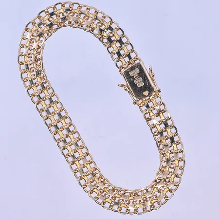 Armband X-länk längd 19cm bredd 9mm fint skick 18K. Vikt: 15 g
