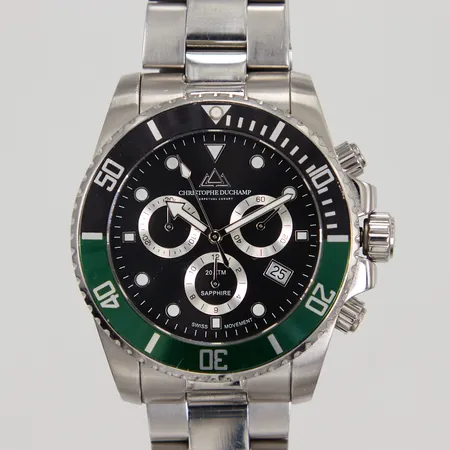Herrur Christophe Duchamp MArine Chrono, ref: CD8201-04, quartz, stål, Ø 42mm, datum, safirglas, länk med viklås, total längd ca 19,5cm, kronan fäster ej i inskruvat läge, kronograf nollställer ej korrekt, inga tillbehör