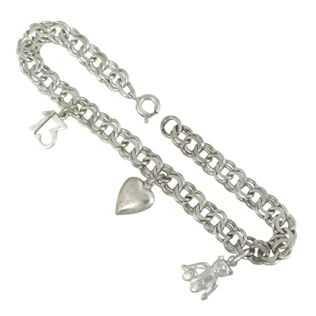 Armband Bismarck med berlocker i silver, längd 17,5 cm, bredd 6 mm, berlocker med varierande mått Vikt: 9,9 g