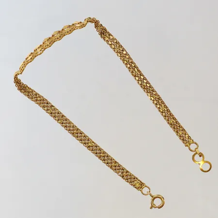 Armband med platta genombruten dekor justerbar längd 19-20cm något ojämn länk 21K Vikt: 5,8 g