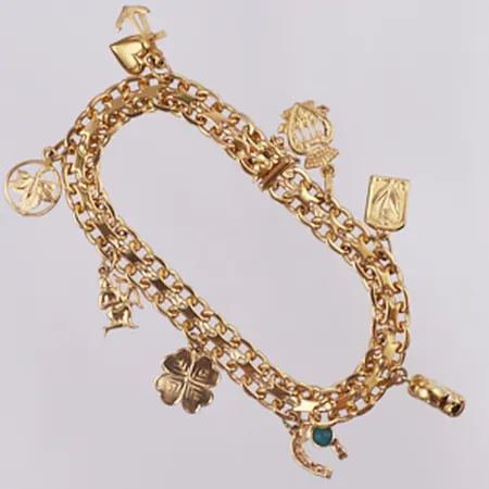 Armband X-länk med berlocker längd 19cm, bredd 7,7mm, 18K Vikt: 26,6 g