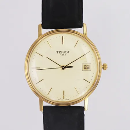 Herrur Tissot 18K quartz Ø34m, datum, repigt glas, svart läderband, står still, troligen behöv av batteribyte, inga tillbehör Vikt: 0 g