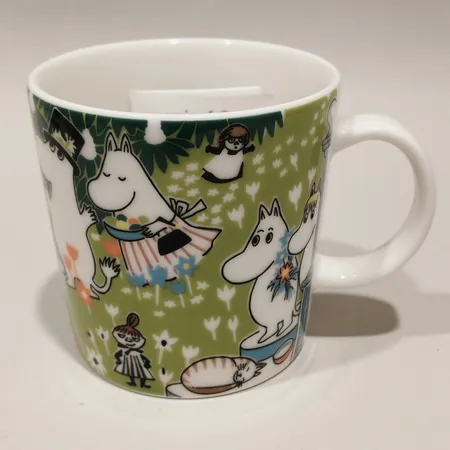 Muminmugg Toves jubileum utan glasögon år 2014 Arabia Finland porslin höjd 8cm Ø8cm 30cl märkt CR0114 stämplad Tove 100.