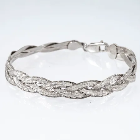 Armband halvstelt flätat längd 19cm bredd 8mm, mönsterdekor en sida, andra sidan blank, Guldfynd, 925/1000 8,6g.