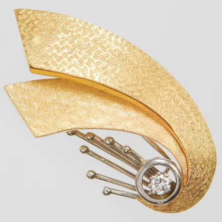 Brosch med diamant 1x 0,14ct, 43x23mm, två färgad, importstämplad, 18K Vikt: 10,2 g