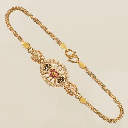 Armband med syntetiska rubiner samt färgade stenar, längd 19cm bredd 14mm lätt skev länk 21K Vikt: 5,3 g