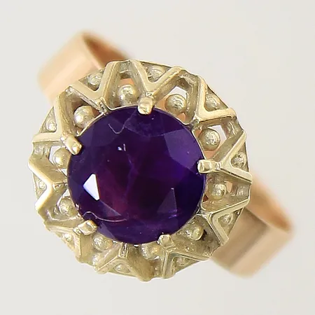 Ring med lila sten stl:18 bredd 4,2-14,2mm 14K Vikt: 4,7 g