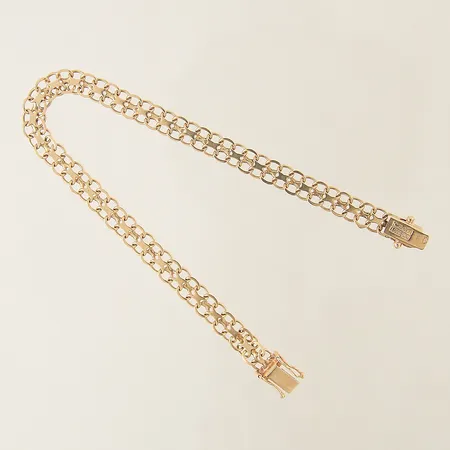 Armband X-länk längd 19cm bredd 5,7mm 18K Vikt: 7,2 g