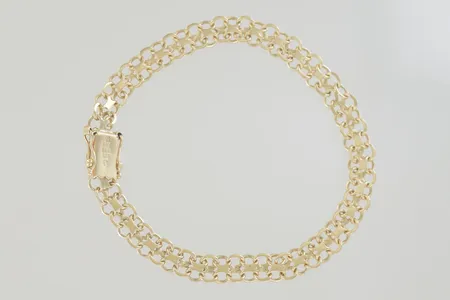 Armband längd 19,5 cm bredd 6 mm 18K Vikt: 11,3 g på auktion i Växjö hos Pantbanken Sverige