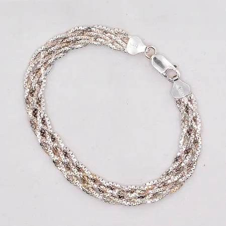 Armband flätad längd 18,5cm bredd 8mm GHA silver 925/1000 Vikt: 7,4 g på auktion i Västerås hos Pantbanken Sverige
