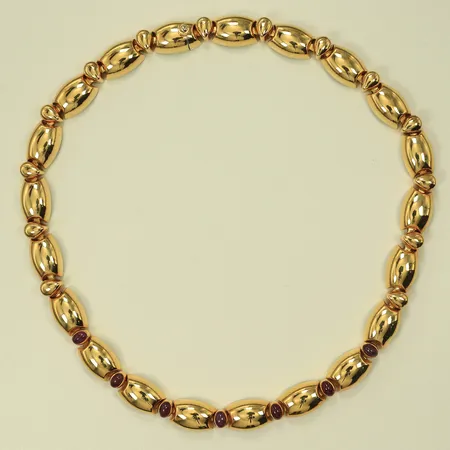 Halscollier med 7 rubiner, längd 44cm bredd 11mm tjocklek ca 7mm, 18K 87,3g totalt
