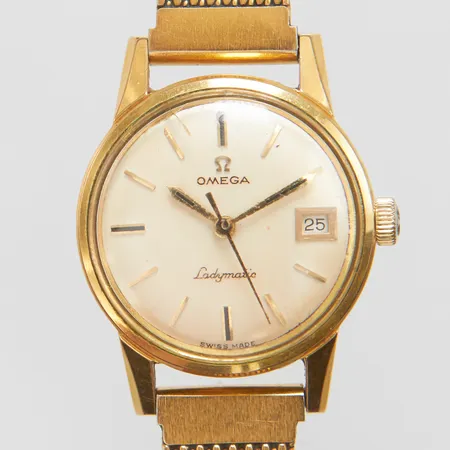 Damur Omega Ladymatic Ø22mm, automatisk, datum, guld på stål, repigt glas, färg bortfall.
