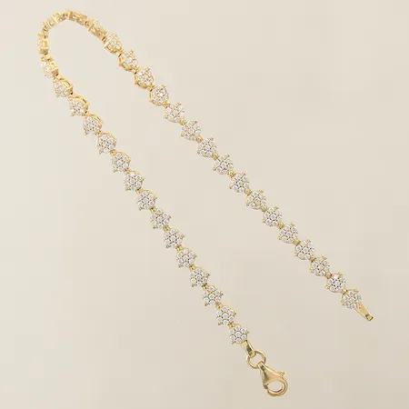 Armband med vita stenar längd 17,5cm bredd 4,5mm 18K Vikt: 6,5 g på auktion i Solna hos Pantbanken Sverige