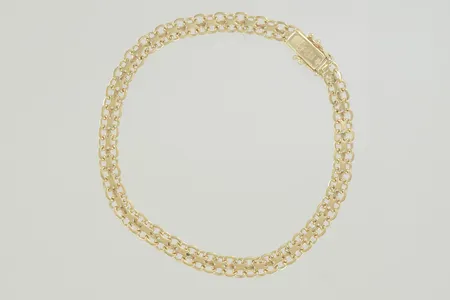 Armband x-länk längd 19 cm bredd 5 mm, 18K  Vikt: 7,9 g