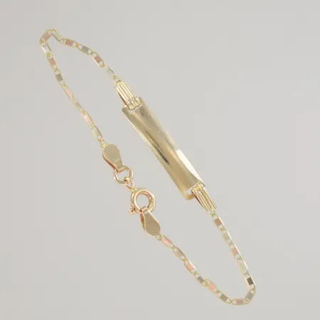 Armband med bricka längd 13 cm bredd 4 mm, 18K Vikt: 1,6 g på auktion i Växjö hos Pantbanken Sverige