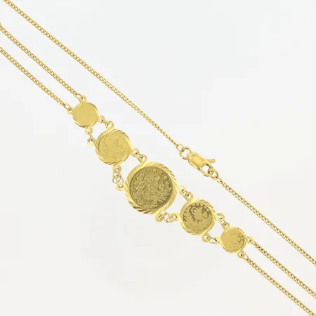 Collier med myntliknande berlocker 43,5cm, bredd 1-15mm, 21K. Vikt: 8,6 g på auktion i Malmö Triangeln hos Pantbanken Sverige