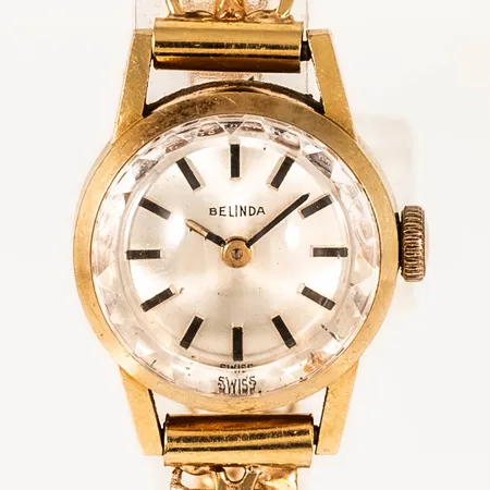 Damur Belinda manuell guld 18K Ø17mm safirglas, urband X-länk med stav 18K total längd 19cm bredd 6,7mm, trög att dra upp, bruttovikt 18,7g.