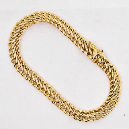 Armband längd 18cm bredd 6,8mm ihålig 14K Vikt: 6,7 g på auktion i Västerås hos Pantbanken Sverige