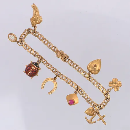 Armband Bismarck längd 18,3cm bredd 4mm 8 berlocker, en sten saknas på hjärtat, 18K Vikt: 12,6 g