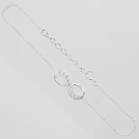 Armband evighetstecken med vita stenar längd: 17-20,4cm, bredd: 1,2-8mm, silver 925/1000 Vikt: 2,5 g på auktion i City hos Pantbanken Sverige